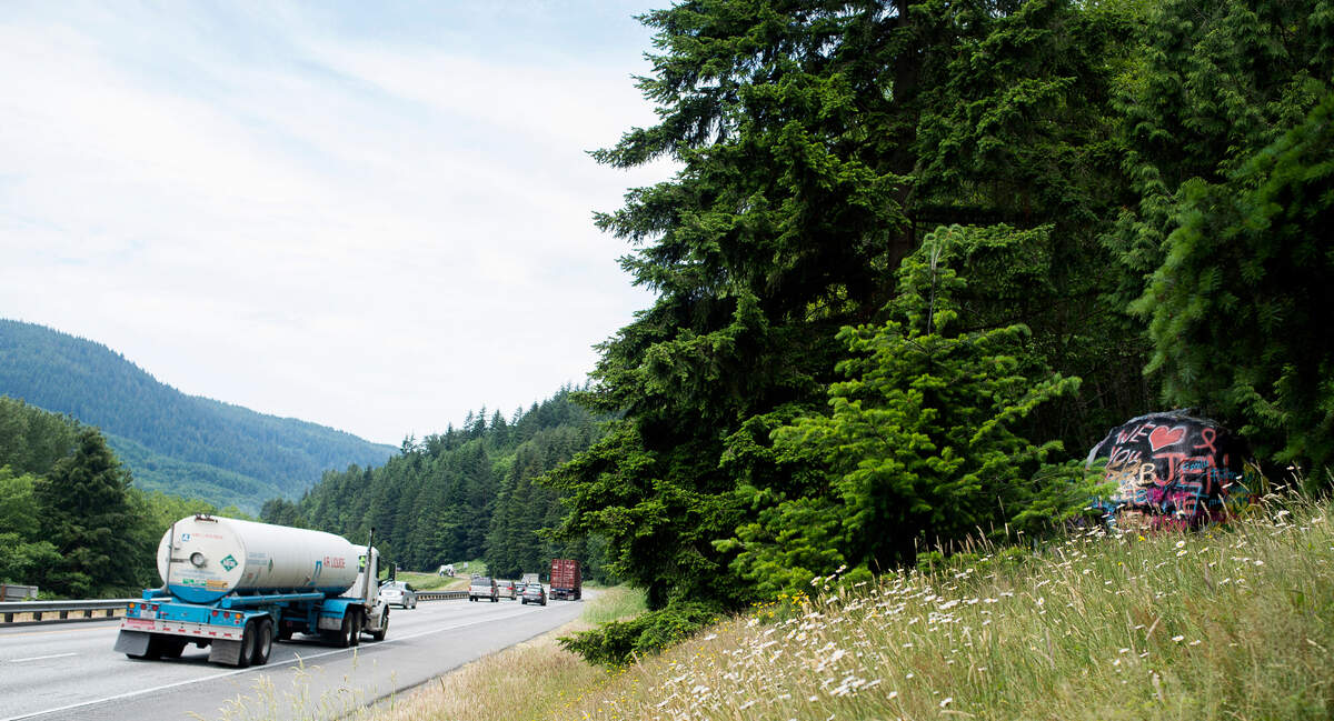 Vehicles travel north on Interstate 5 past the "graffiti rock" on near Bellingham in 2018.