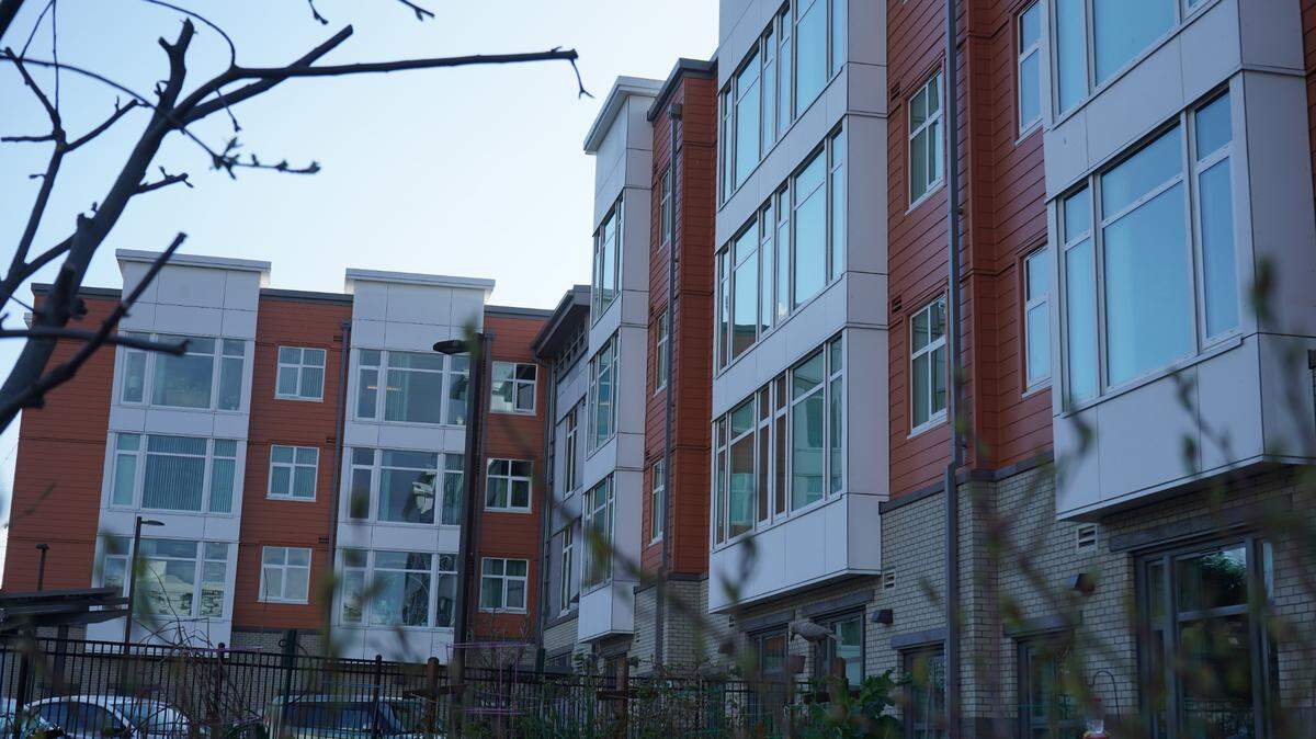 The sun sets behind the Eleanor Apartments on Tuesday, April 11, 2023, at 1510 N. Forest St. in Bellingham, Wash. The affordable housing complex is designed to house tenants who make 30% and 50% of the area’s median income.