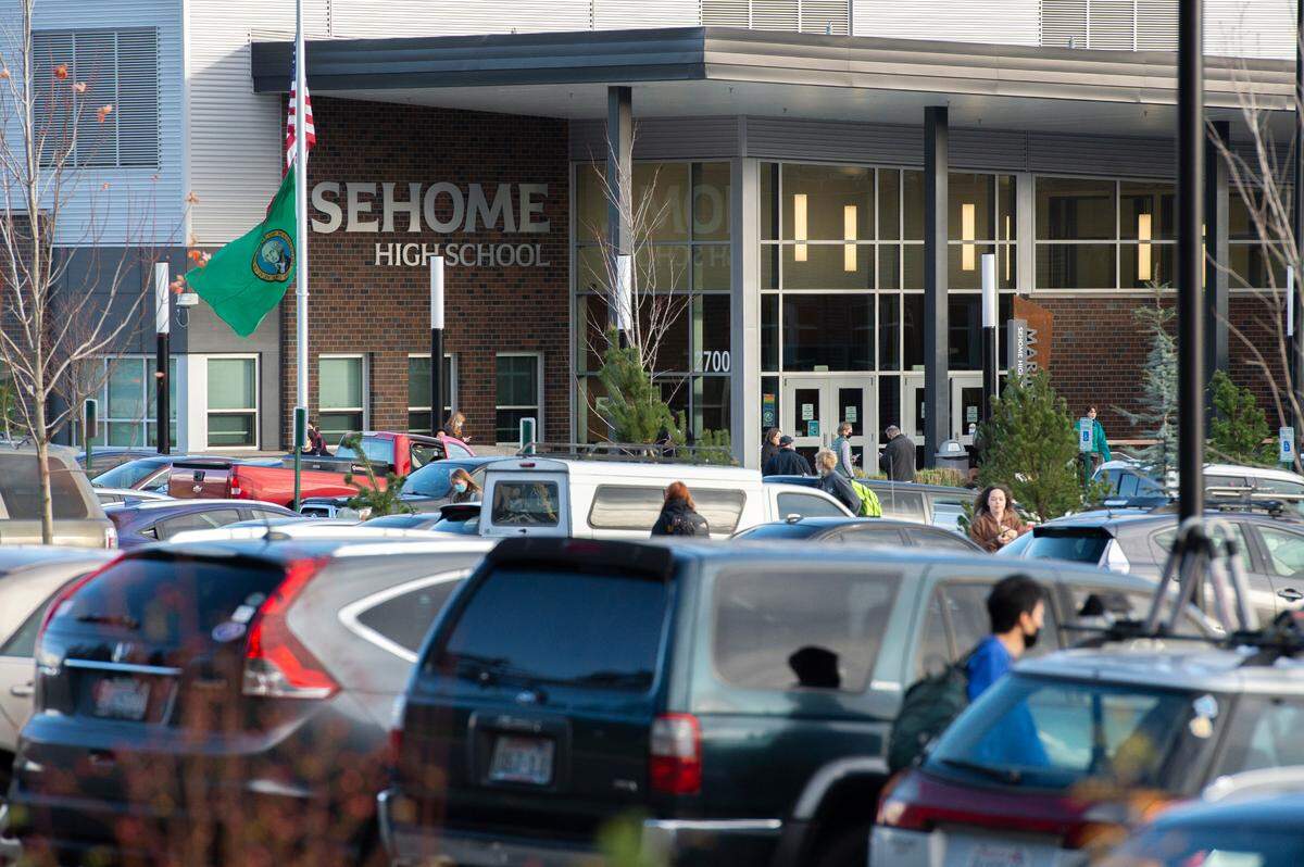 Students leave Sehome High School’s campus following a lockdown caused by a threat later deemed not credible on Wednesday, Dec. 8, in Bellingham.