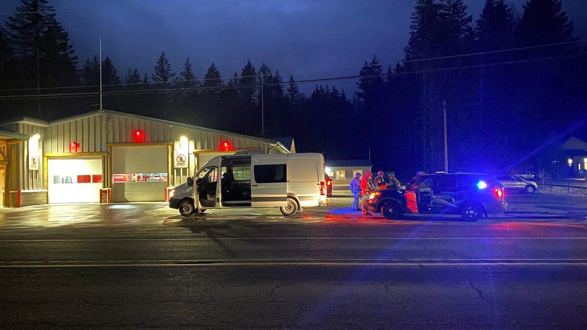 A Bellingham Police Department car is staged at the Whatcom County Fire District 14, Station 92, on Mount Baker Highway near Kendall Road Thursday, Feb. 10. Law enforcement was investigating the shooting of two Whatcom County Sheriff’s Office deputies who were reportedly trying to break up a neighborhood dispute in which two people were shooting at each other in the Peaceful Valley area.