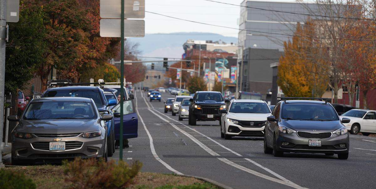 Vehicles drive along North State Street in Bellingham.