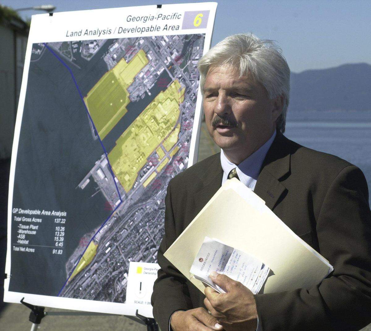 Then-Port of Bellingham Executive Director Jim Darling talks during a press conference in 2004, at Georgia-Pacific West Inc. He announced the port’s intention to acquire all of G-P’s waterfront property, including the aerated stabilization basin that juts into Bellingham Bay, in exchange for cleaning up the property.
