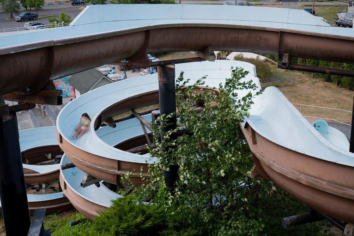 A girl slides down a waterslide at Birch Bay Waterslides near Blaine, Washington, in this 2021 file photo.