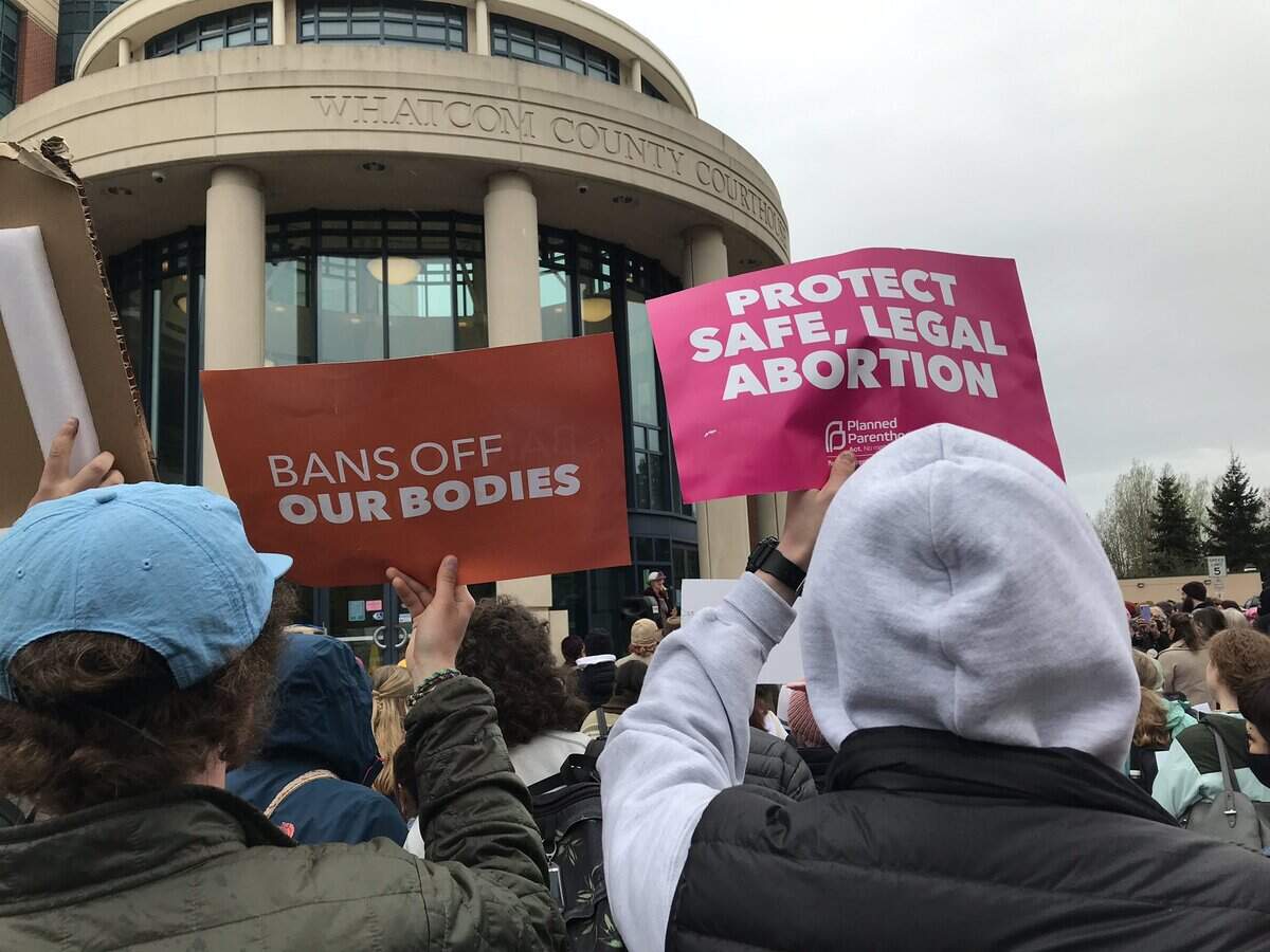 A crowd of about 500 people held up signs at a rally for abortion rights May 3, 2022, at the Whatcom County Courthouse in Bellingham.