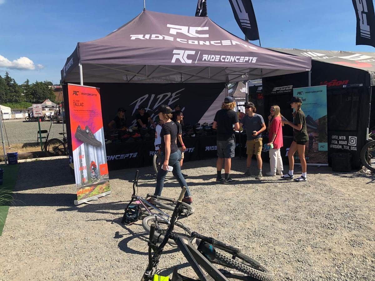 Festival attendees visit the Ride Concepts booth Sunday, July 10, near Waypoint Park on the waterfront in Bellingham during the Northwest Tune-Up festival.