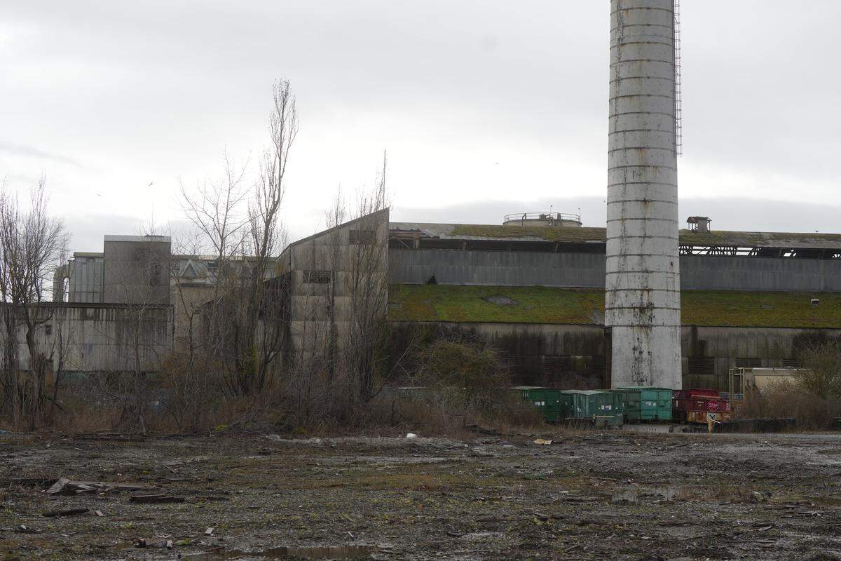 A parcel zoned Heavy Impact Industrial (HII) on Marine Drive remains undeveloped in front of the Heidelberg Materials cement facility. The parcel was listed for sale after being purchased by ABC Recycling for a proposed metal shredder facility that ultimately did not come to fruition. Nearby residents are hoping the parcel is rezoned to prevent other heavy industrial operations from developing the site.