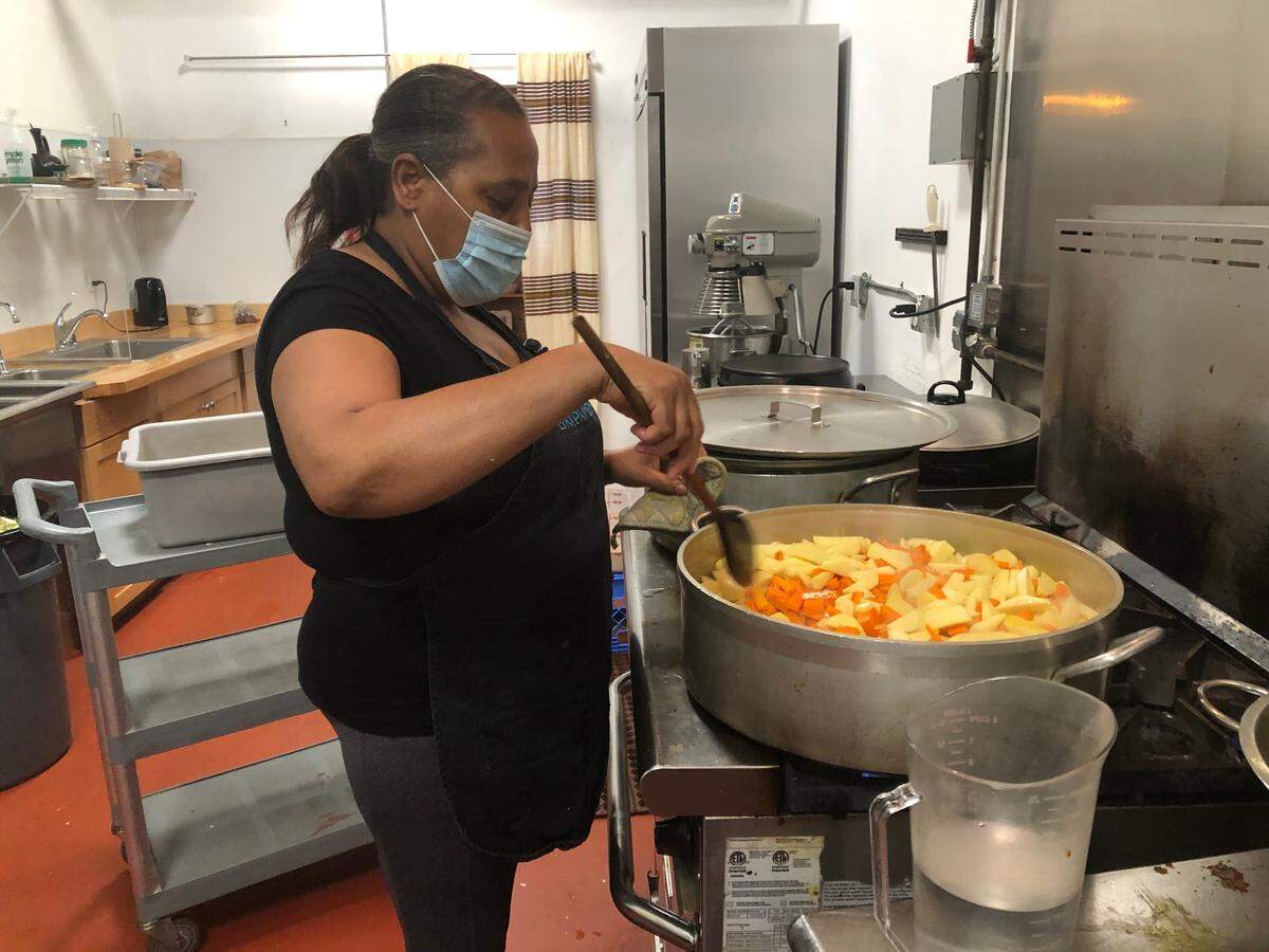 Mulunesh “Mulu” Belay works in the kitchen of Ambo Ethiopian Cuisine in downtown Bellingham on Friday, July 24. Belay, who moved with her family to Whatcom County from Ethiopia in 2002, said that she has felt supported living in Whatcom County but added that work needs to be done to change systemic racism, particularly for people of color who were born in the U.S.