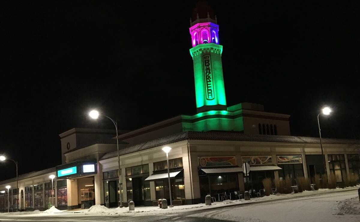Mount Baker Theatre shines after the latest of a series of storms left snow-covered streets in Bellingham Friday.