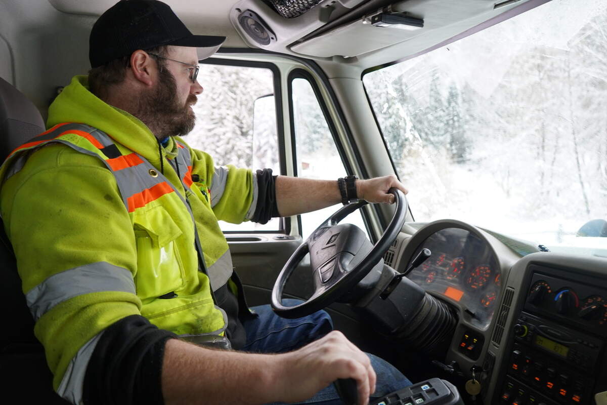 Jess Herring operates a snow plow on Tuesday, Dec. 20, in Bellingham after significant snowfall hit Whatcom County.