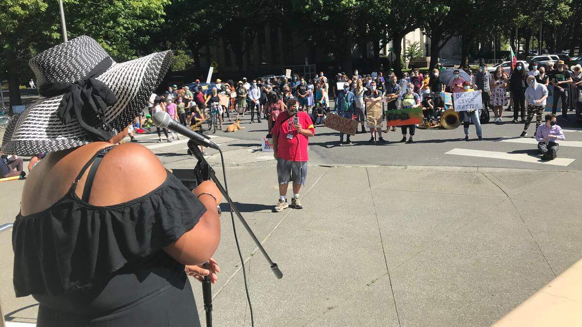 Kristina Michele Martens, who is running for Bellingham City Council, addresses the crowd during an Aug. 27 rally at the Whatcom County Courthouse.