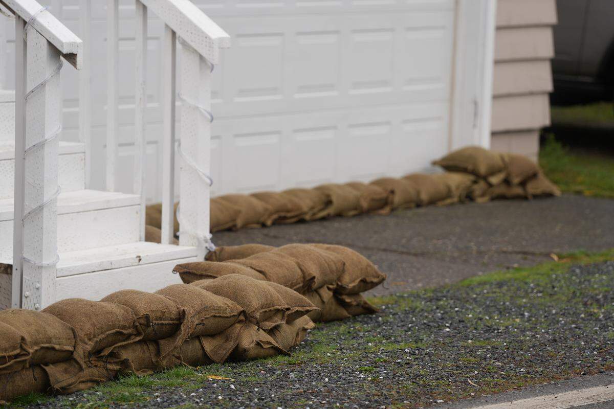 Sandbags are lined around the perimeter of a home in the Nooksack River flood zone on December 12, 2025, in Ferndale, Wash.