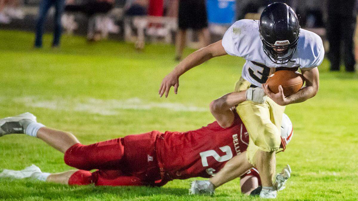 Bellingham inside linebacker Finn O’Malley (23) takes down Meridian running back Josh Elmer (30) behind the line of scrimmage for a short loss during the first quarter on Friday evening Sept. 24, 2021, at Meridian High School in Laurel, Wash. Meridian defeated Bellingham 26 to 14.
