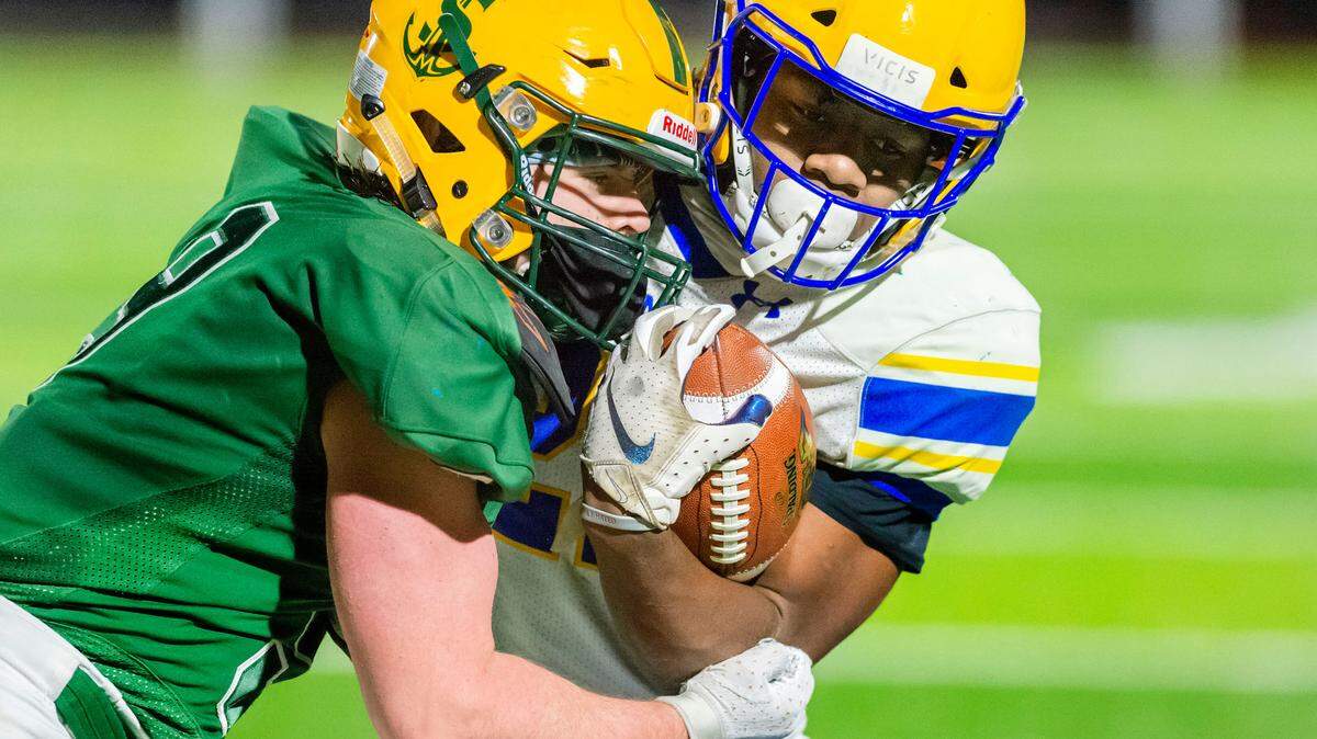 Sehome defender Colin Dorsch (9) stops Ferndale running back Isaiah Carlson (22) March 6, 2021, at Sehome High School in Bellingham. The fall 2021 Whatcom County football season will be significantly different than both the regular-length 2019 campaign and the unique six-round 2021 winter schedule.