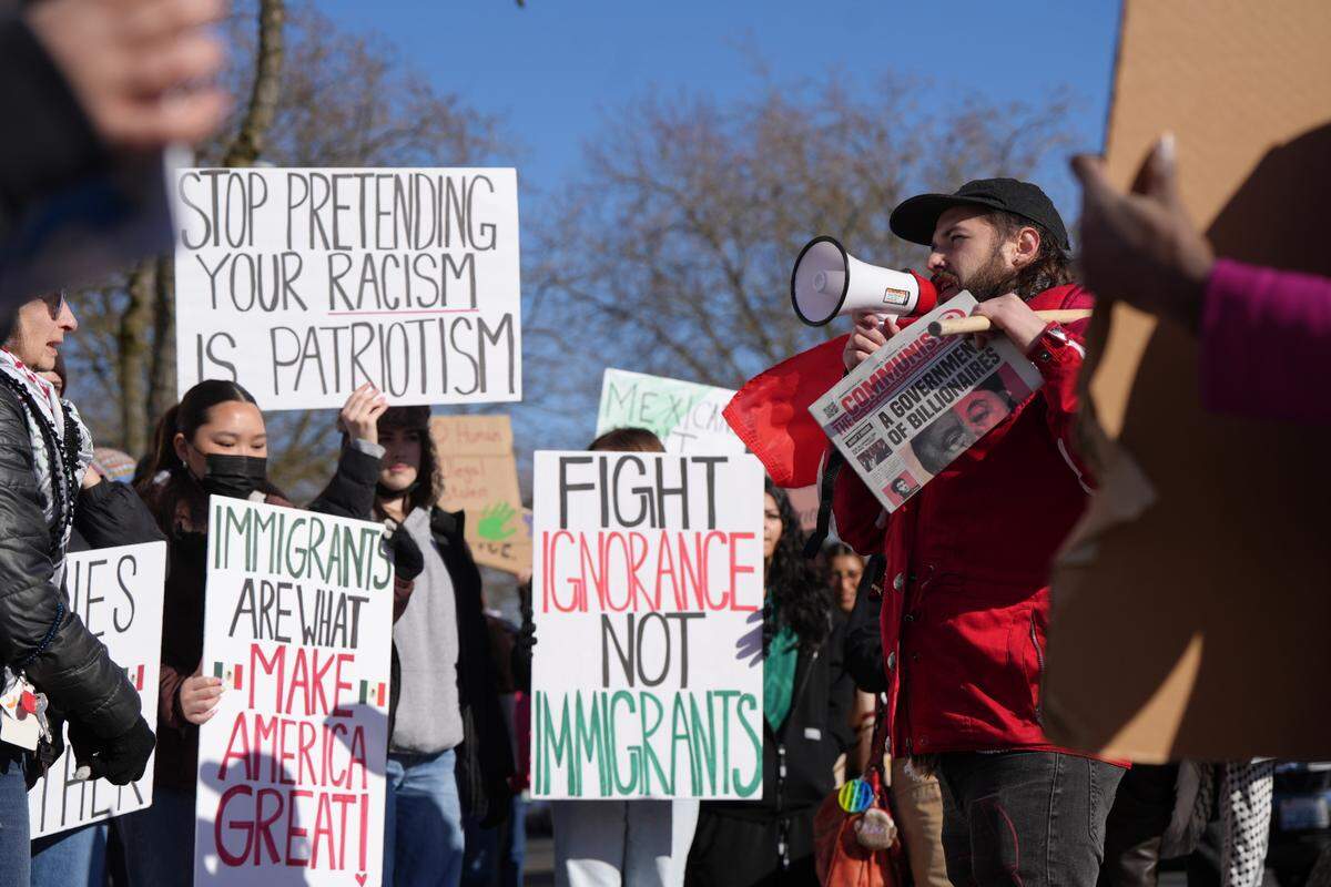 More than 100 people protested ICE and undocumented immigrant deportations on Feb. 9 in Bellingham.