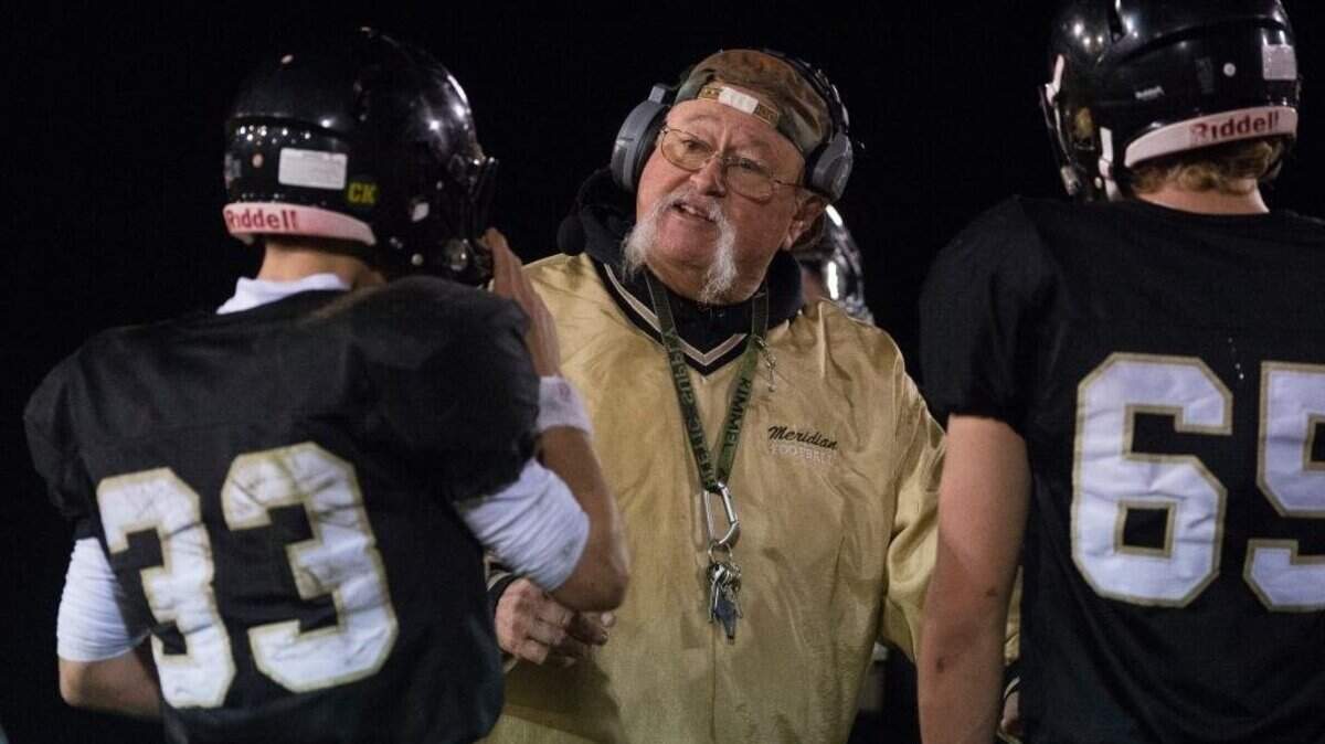 Meridian coach Bob Ames talks with his players during a Friday, Oct. 6, 2017, game against Mount Baker.