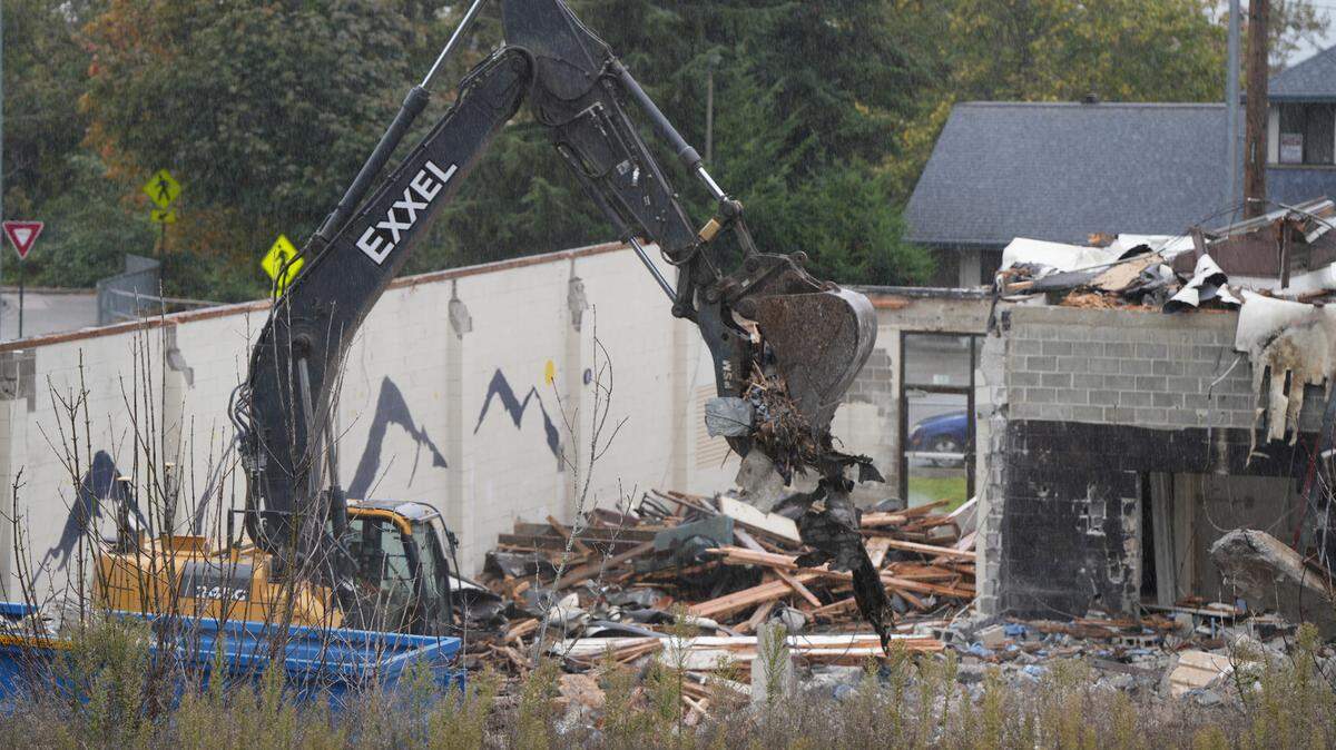Crews demolish the former dairy building at 820 N. State Street on Oct. 8, 2024, in downtown Bellingham. A six-story, mixed-use commercial and housing project will be built in its place.