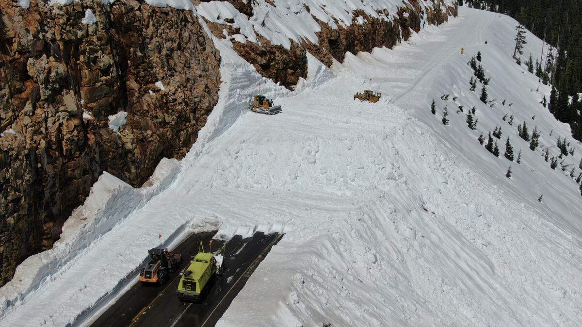 Washington State Department of Transportation road crews clear snow from state Highway 20, also called the North Cascades Highway, between Newhalem and Winthrop, Wash., on April 22.