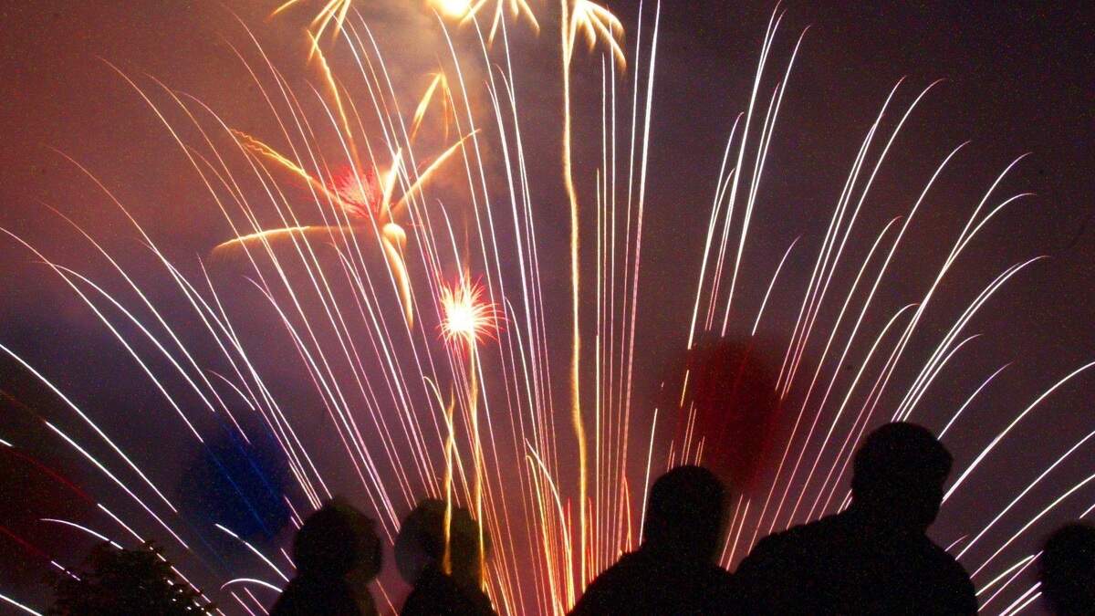 Spectators watch the Fourth of July fireworks in Bellingham from the top of a parking garage in downtown in 2000.