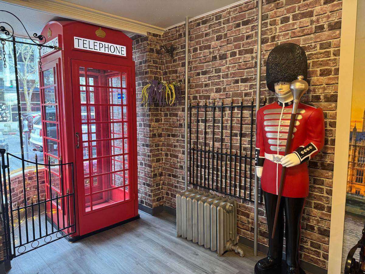 A replica telephone booth and London Guard at Love From London restaurant at 1301 Commercial St.