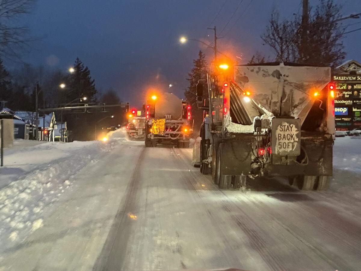 Bellingham Public Works crews work overnight to clear snow and prepare for ice Friday, Dec. 23.