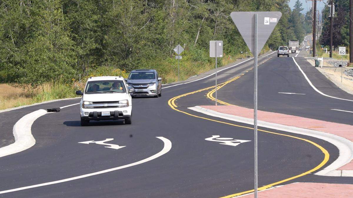 Vehicles enter a Whatcom County roundabout.