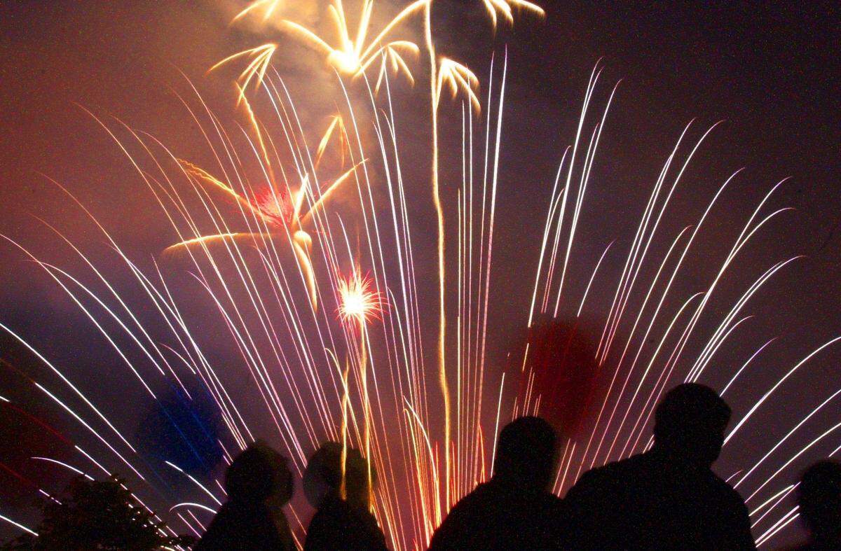 Spectators watch the Fourth of July fireworks in Bellingham from the top of a parking garage in downtown in 2000.