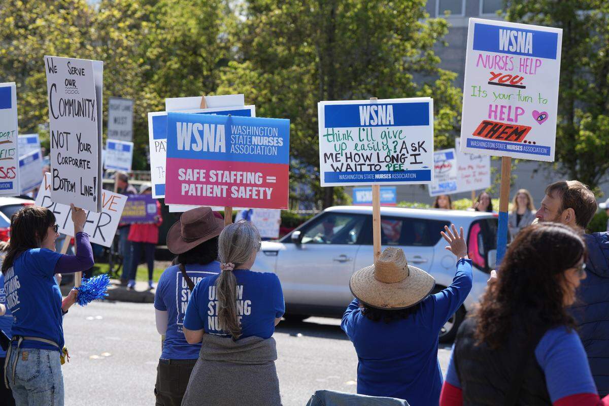 PeaceHealth nurses held an informational picket outside of St. Joseph Medical Center amid stalled contract negotiations on Tuesday. The nurses are calling for more competitive wages and better health care.