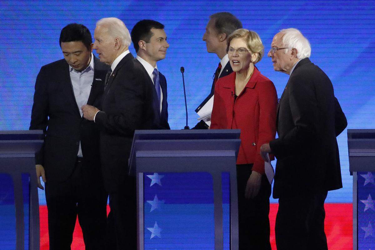 Democratic presidential candidates leave the stage after a Democratic presidential primary debate Feb. 7 at Saint Anselm College in Manchester, New Hampshire. Entrepreneur Andrew Yang, left, who left the campaign Feb. 11, is with former Vice President Joe Biden, former South Bend, Indiana, Mayor Pete Buttigieg, businessman Tom Steyer, Sen. Elizabeth Warren, D-Mass., and Sen. Bernie Sanders, I-Vt.