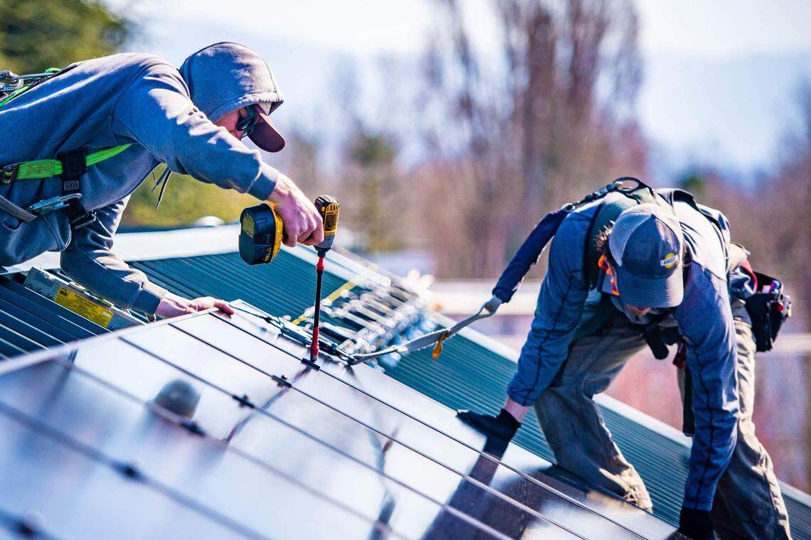 A Western Solar crew installs rooftop solar in Bellingham in 2020. Community colleges and the City of Bellingham are developing plans to grow a trained workforce for the solar industry.