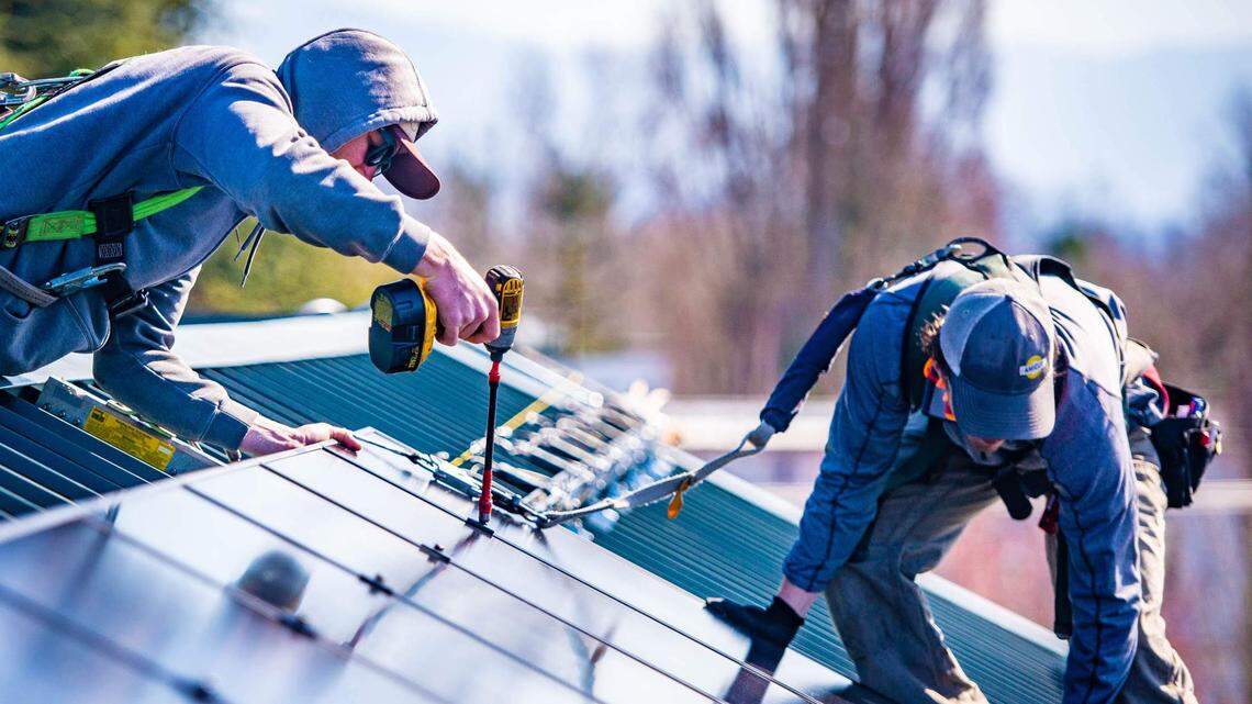 A crew installs rooftop solar in this 2020 file photo.