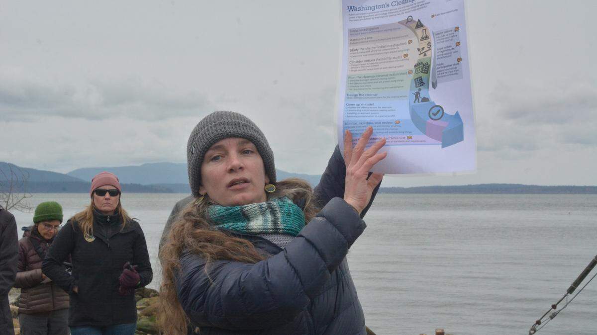 Eleanor Hines, the North Sound Waterkeeper for RE Sources, shows information about the RG Haley cleanup to participants in a tour of the site at the south end of Cornwall Avenue in Bellingham on Tuesday.