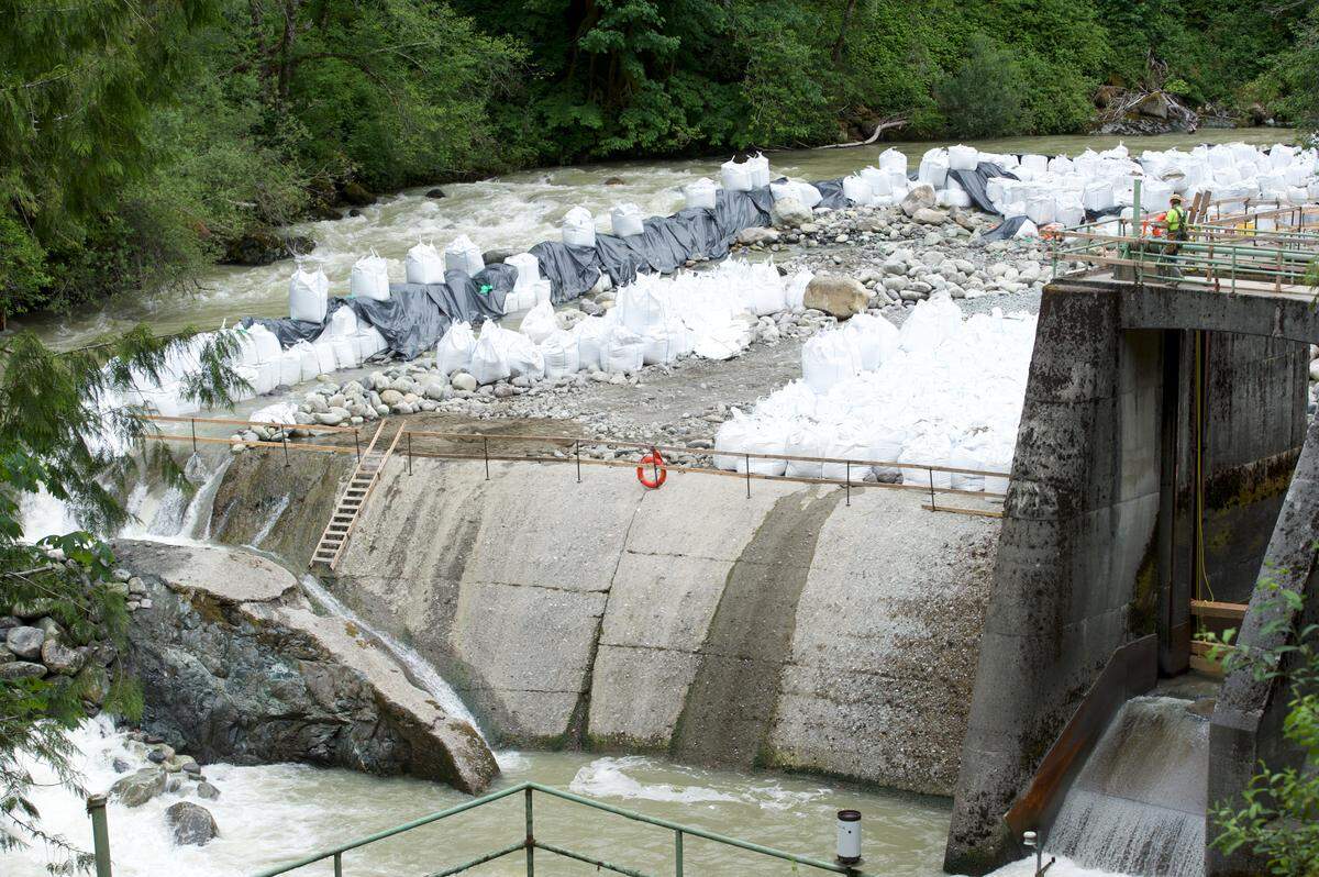 The Middle Fork of the Nooksack River is moved around a dam on Friday, June 26, in Whatcom County. The small city of Bellingham dam, about 7 miles southeast of Deming, is being removed so the river can flow freely, allowing threatened fish species — one of which is a vital food source for endangered southern resident orcas — a better chance at survival.