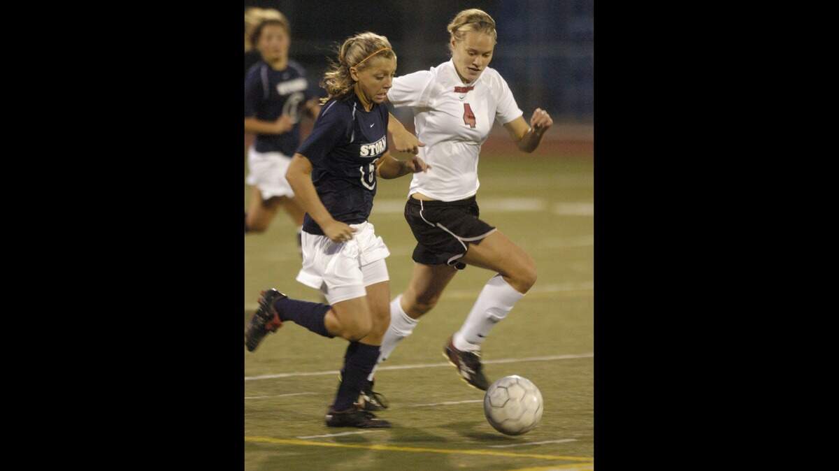 Squalicum High’s Stacie Morse, left, and Bellingham High’s Molly Shannon battle for the ball in a 2006 game at Civic Stadium. Morse was a flight nurse on plane that went missing Monday near Kake, Alaska.