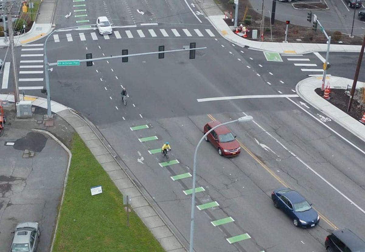 A cyclist rides on a newly striped bike lane on Samish Way at Bill McDonald Parkway in a city photo released in December 2020.