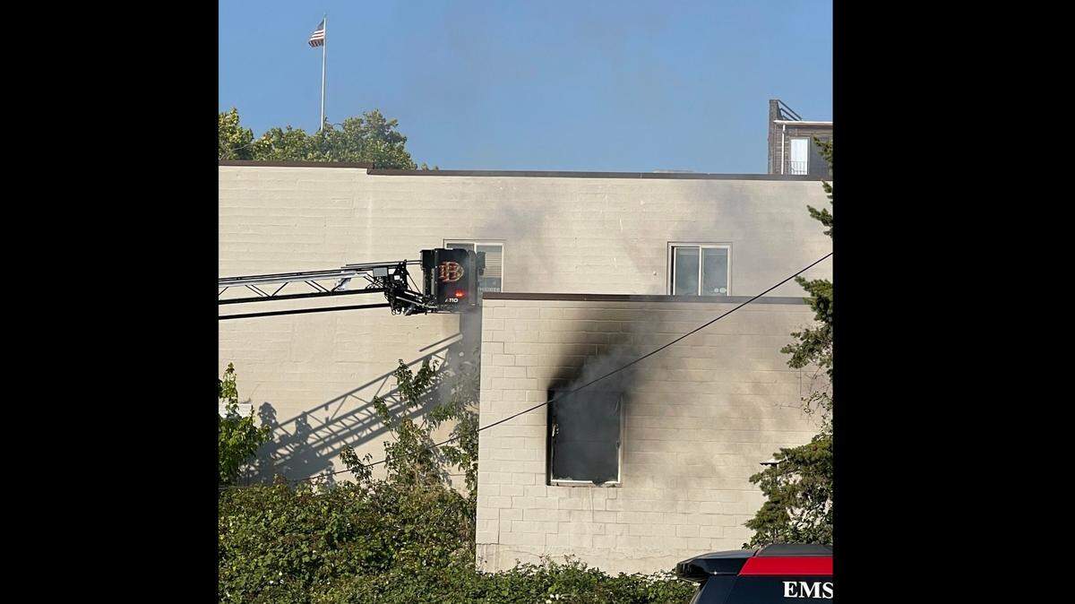 Smoke damage is visible on the outside of a commercial building that experienced a fire just before 5 p.m. on Monday, Aug. 7, in downtown Bellingham, Wash.