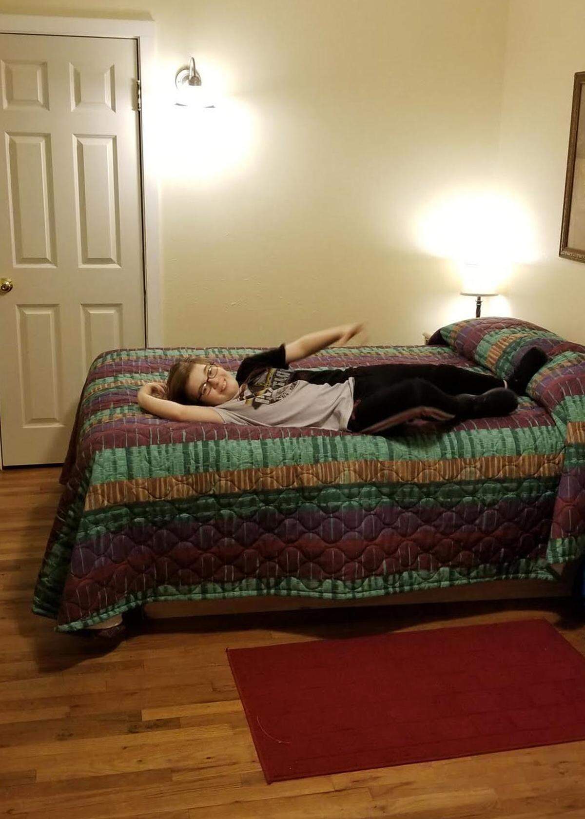 William Fifield, 13, lies on a bed at The Firs Retreat Center, a Family Promise host congregation, in Bellingham in November 2018.