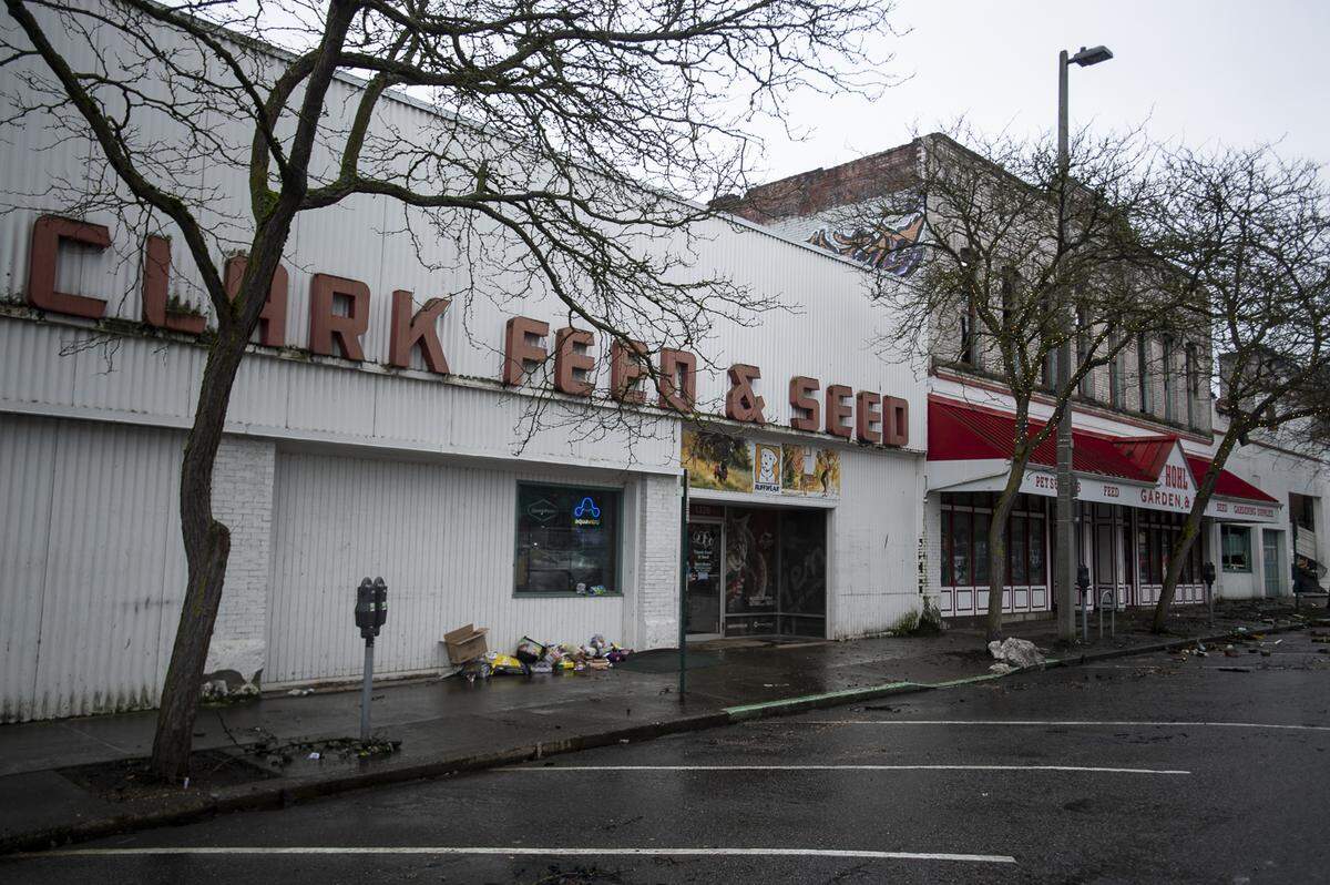 The Clark Feed & Seed building sits unharmed alongside a destroyed Hohl Feed & Seed in Bellingham on Tuesday.