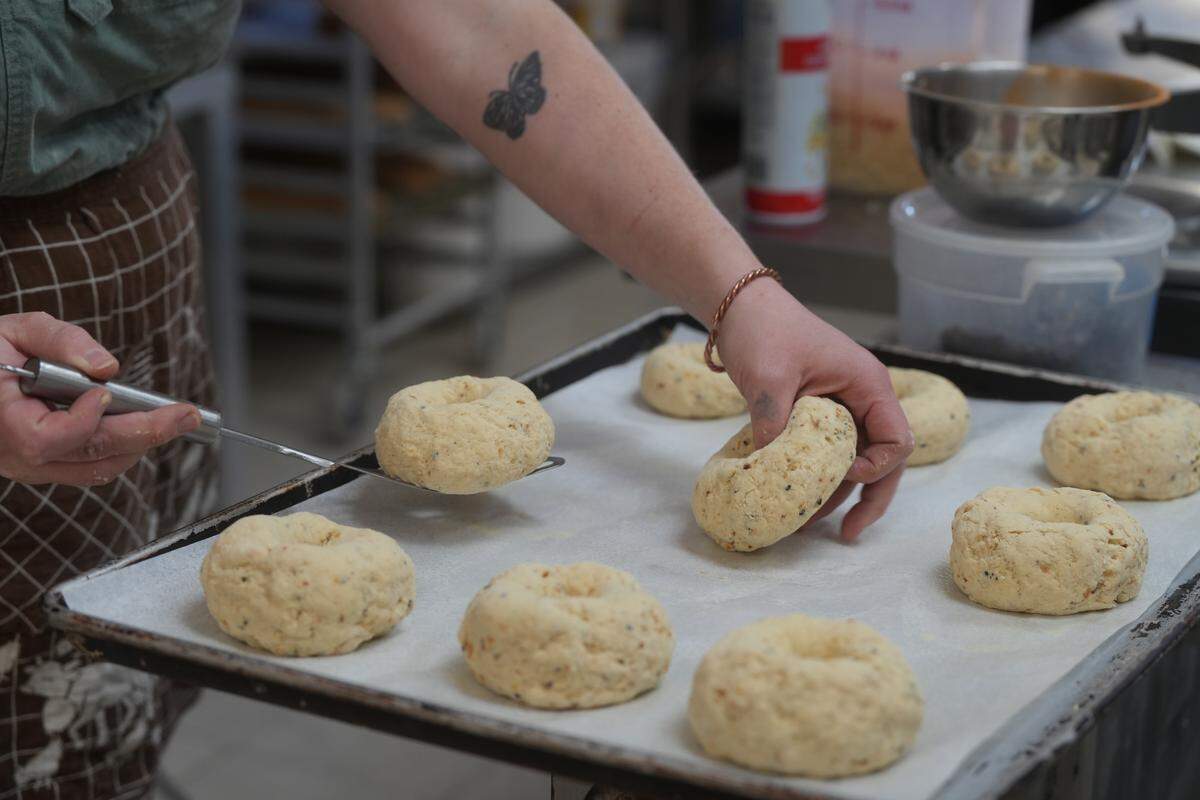Clara Dwyer prepares to bake jalapeño cheddar bagels.