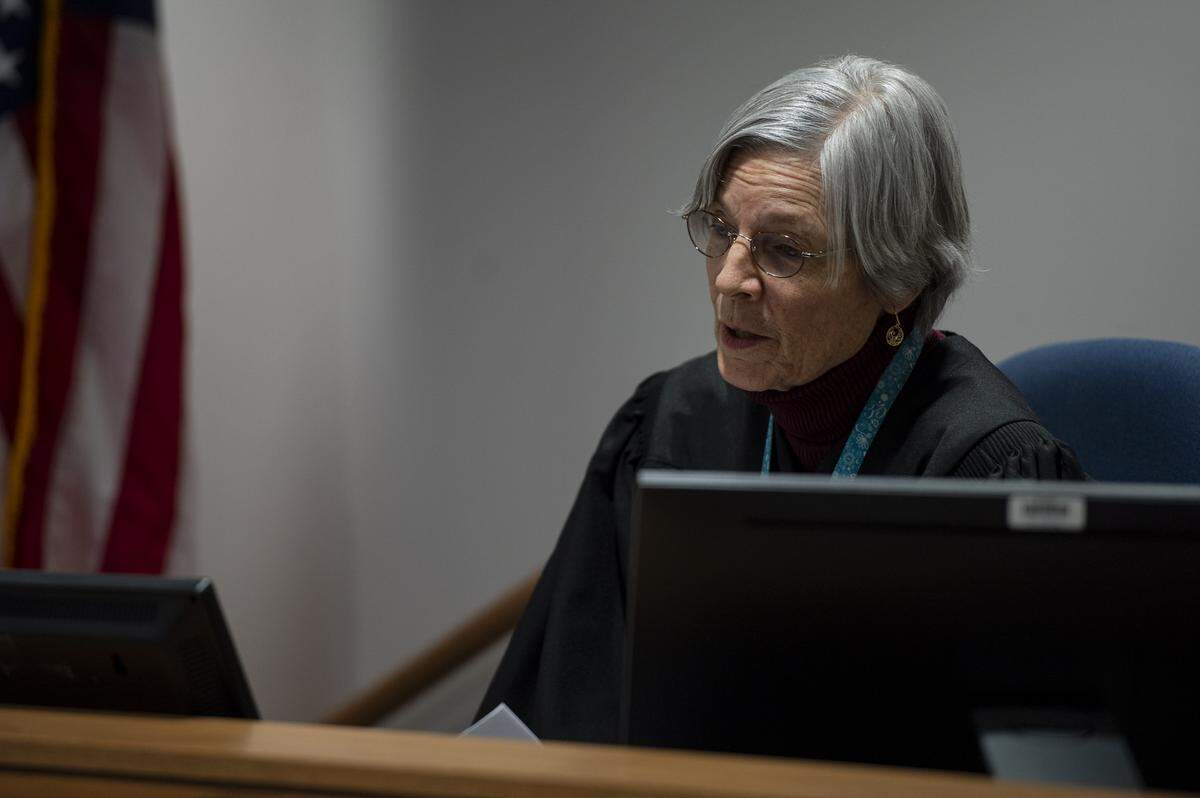 Whatcom County Court Commissioner Pro Tem Pamela Englett speaks to Cody Mitchell Brock through a screen during his first appearance on one count of first-degree murder at Whatcom County Superior Court on Wednesday.
