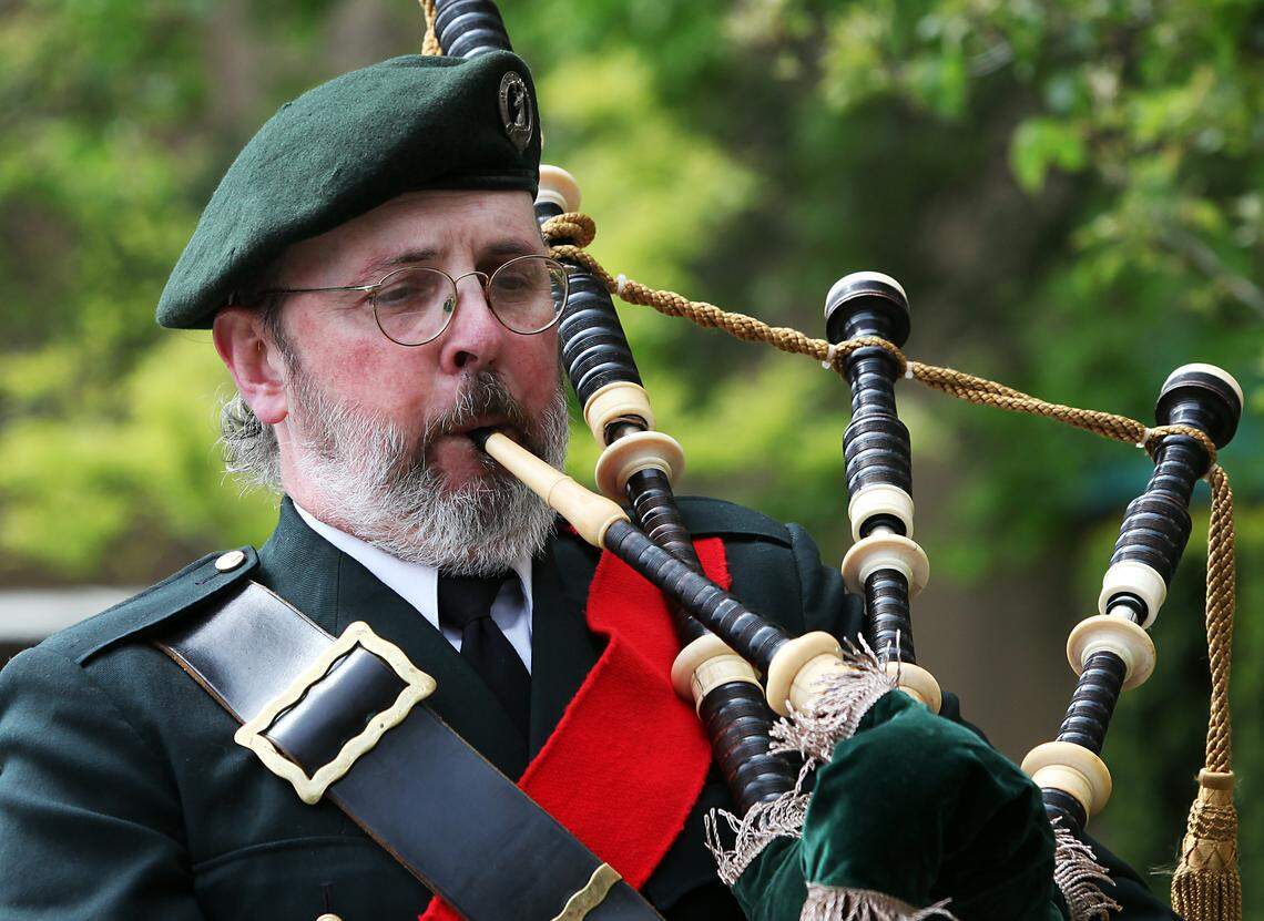 Judge Ira Uhrig plays the bagpipe at the beginning of a ceremony honoring Spc. Aaron Aamot at the Whatcom County Courthouse in 2010. Uhrig died Monday after battling cancer.