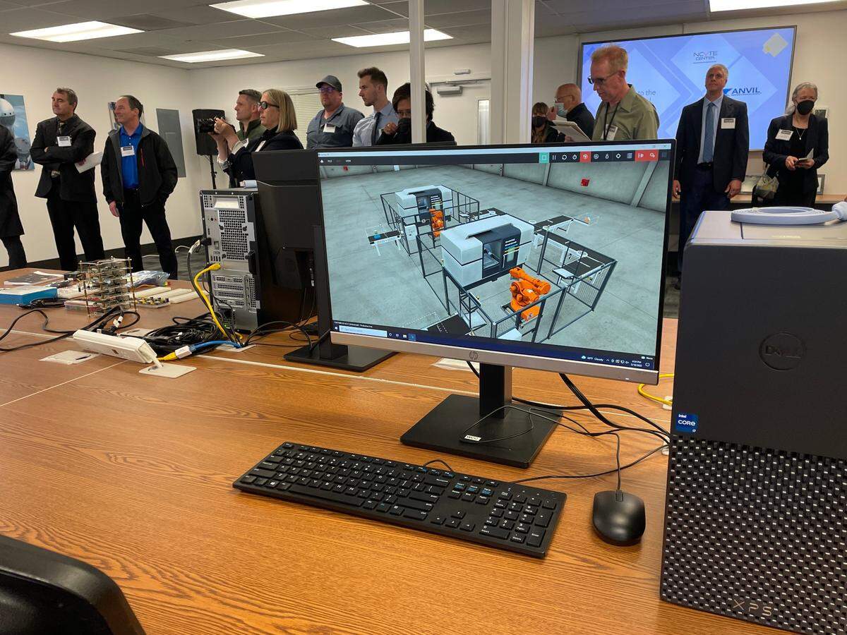 Visitors check out Whatcom Community College’s new Industrial Control Systems Cyber Range Wednesday, May 18, on Anvil Corp.’s campus near the Bellingham International Airport The center focuses on training against cybersecurity attacks.