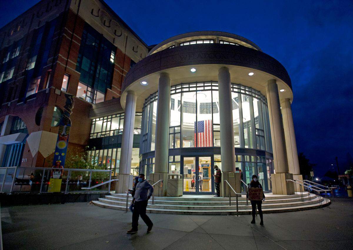 People exit the rotunda of the Whatcom County Courthouse after casting votes in the general election Tuesday night, Nov. 3, in Bellingham.