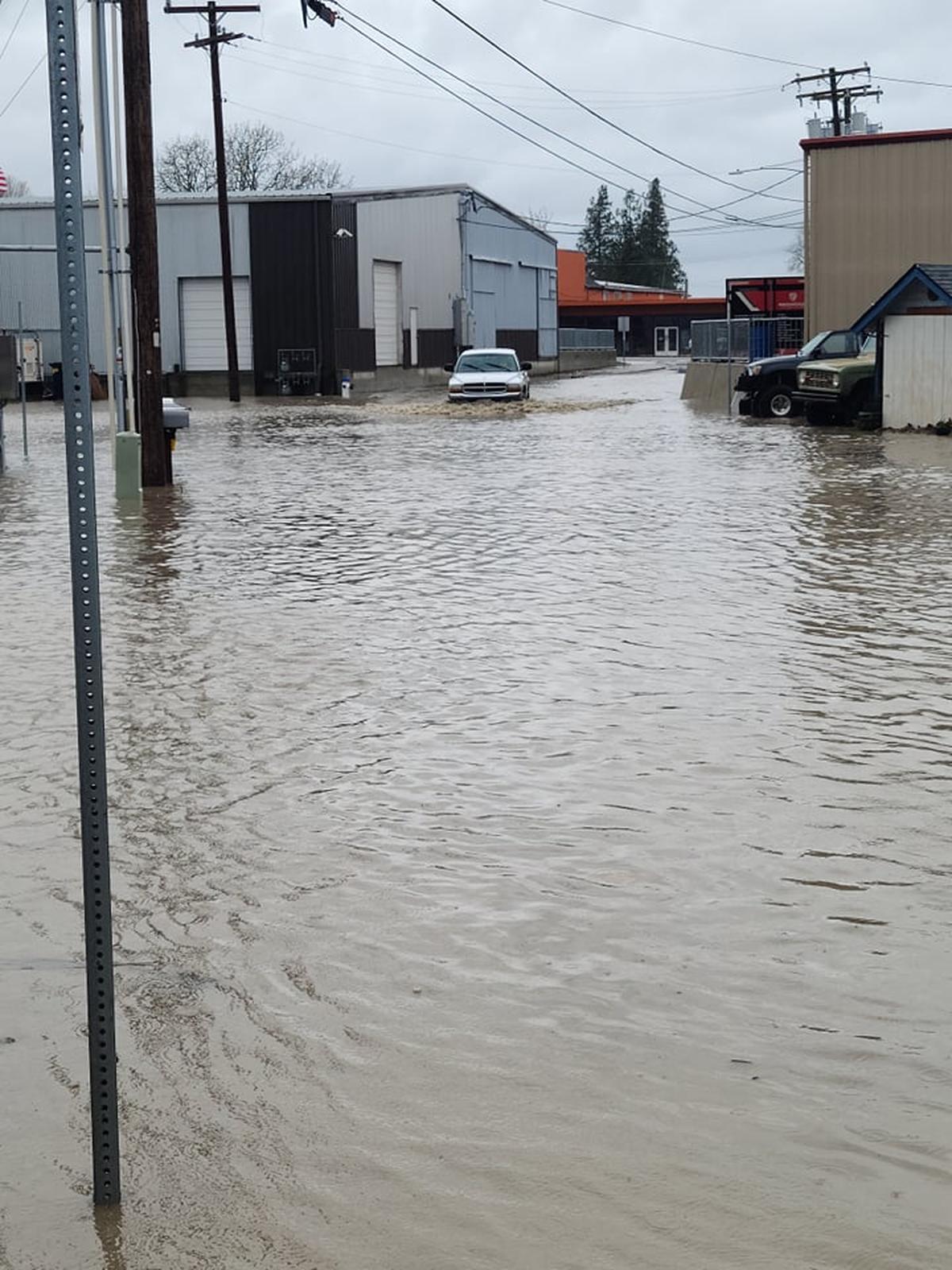 A car is partially submerged in water in Everson as a Pineapple Express brought torrential rain and flooding to Whatcom County Monday, Nov. 15.