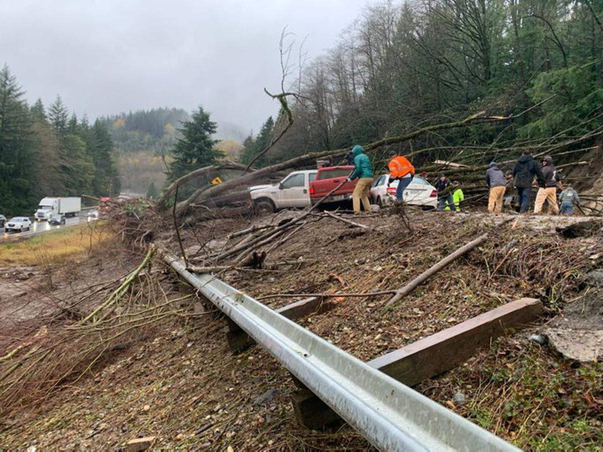 Three cars were trapped in a mudslide Monday afternoon, Nov. 15, along northbound Interstate 5 in Whatcom County south of Bellingham.