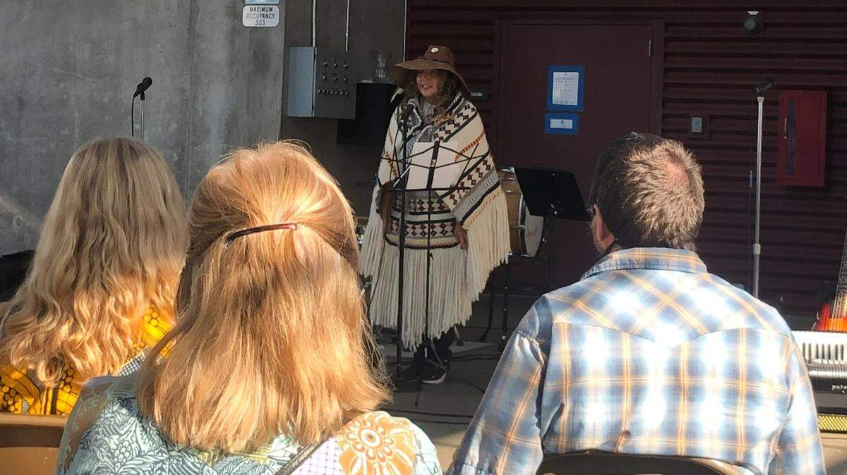 Sadie Olsen (Kwastlmut) accepts the Dale Youth Peacemaker Award at the Whatcom Peace & Justice Center’s 20th anniversary celebration Sunday, Sept. 11, at Market Depot Square in Bellingham.