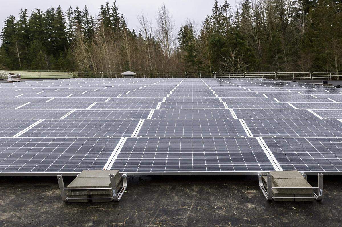 The city of Bellingham received a $1.7 million grant for a community solar array project. This photo shows the solar panels atop one of the water storage tanks at the Whatcom Falls drinking water treatment plant.