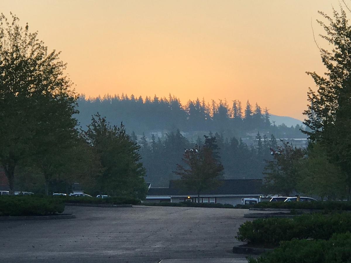 Increased smoke from widlfires in Oregon and California is seen in Friday morning in the Barkley neighborhood of Bellingham.