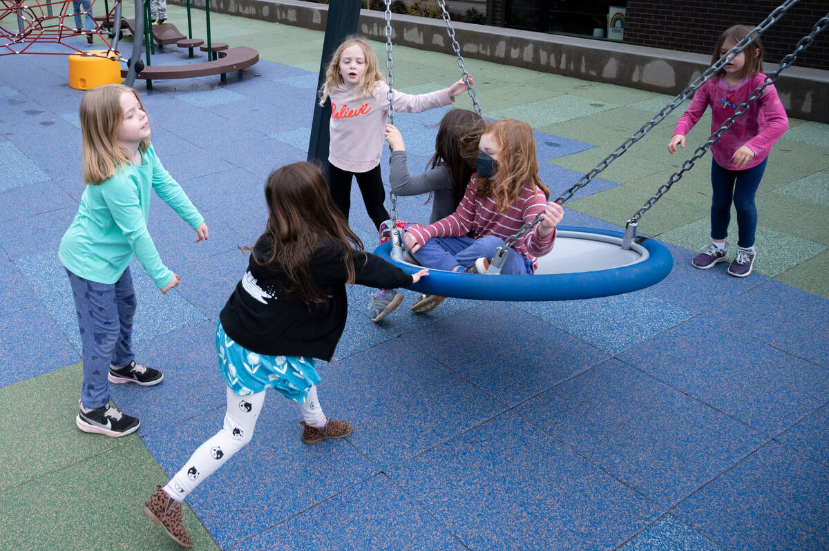 Children play on a recently constructed playground at Parkview Elementary School that includes features that encourage inclusivity on Monday, March 28, in Bellingham.
