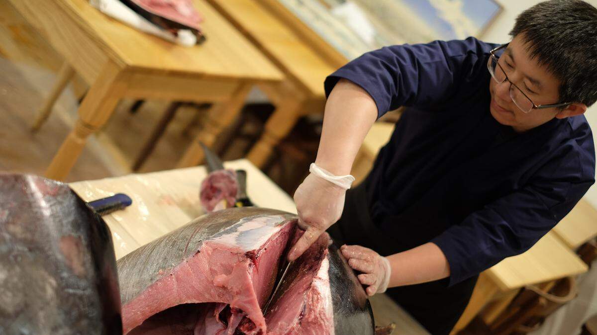 Billy Chen slices into a bluefin tuna this month at his new restaurant Fujisan Sushi. Chen and Mia Zhen opened the eatery Wednesday at 1216 Harris Ave., near 12th Street Shoes in Fairhaven.