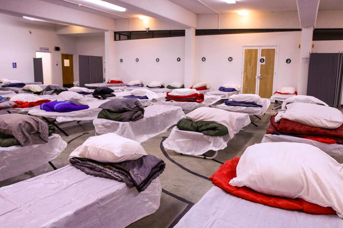Cots are cleaned and prepared for guests at the Whatcom County Severe Weather Shelter in the Central Lutheran Church at 925 N. Forest St. The shelter has space for up to 70 people.